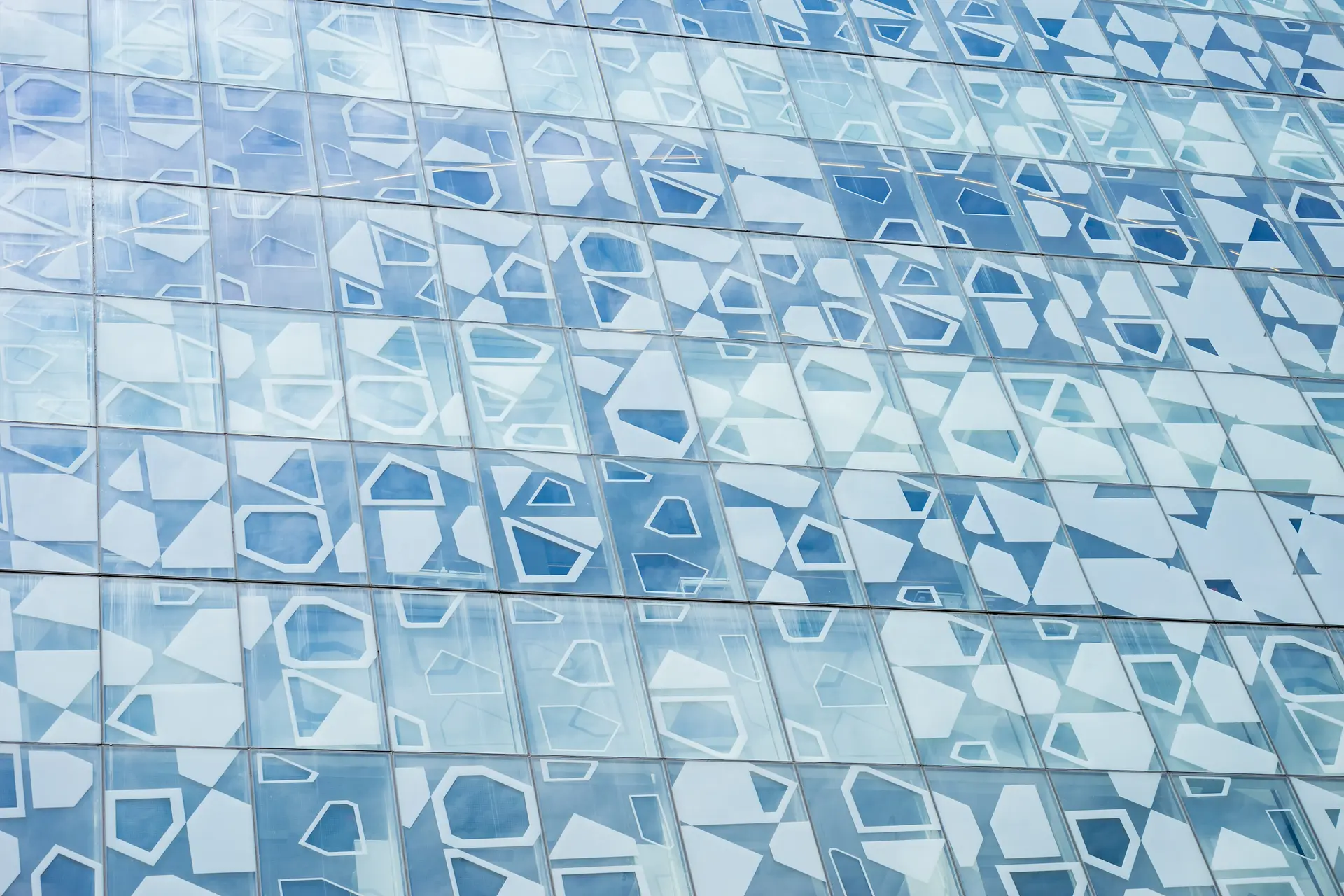 Blue architectural facade made of geometric shapes, used as editorial imagery.