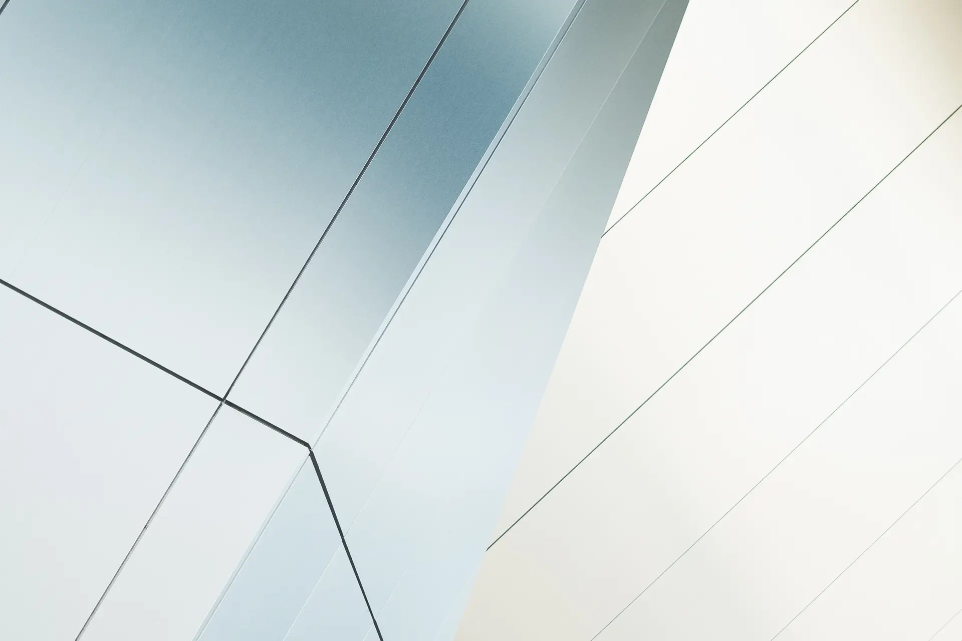 Contemporary white facade made of geometric planes.